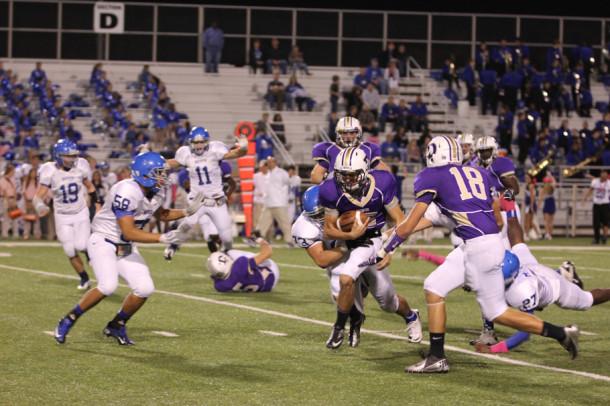 Cy Ward looks for running room during Friday's game against Brewer. Denton started slow and never recovered losing 45-13.