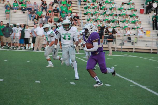 Deavonte Doucet tries to outrun a Lake Dallas defender in Friday's district 5-4A opener. The Broncos dropped the contest 42-28.