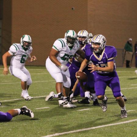 Christian Rodriguez scrambles to gain yards during the Broncos 42-14 victory over Azle on Oct. 25.