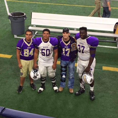 Hayden joins his fellow teammates in a group picture after the varsity football game.