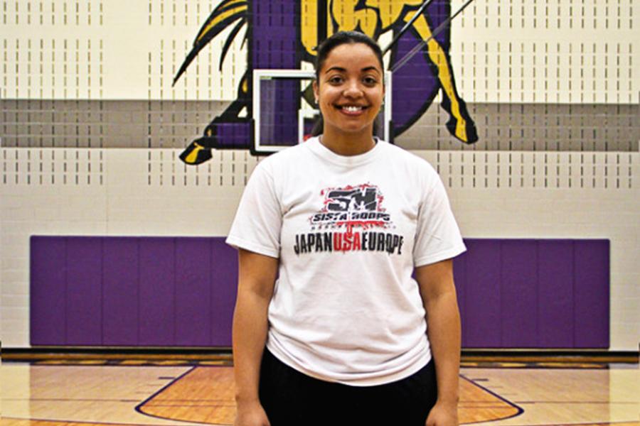 Coach Erin Taylor in her new digs at Denton High after trading in her red Ryan Raider colors for Bronco Purple. Taylor spent the past eight years at Ryan as the assistant girls basketball coach.