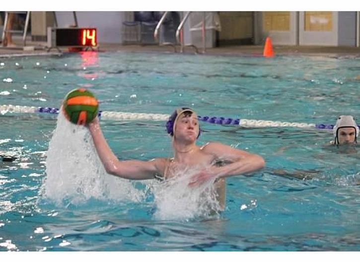 During a recent Water Polo match, Michael Adami scores a goal. 
