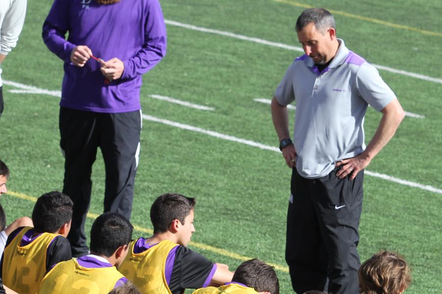 Coach Heffley talks to the Varsity Boys Soccer team during half time at the 2nd round of the soccer playoff games on March 27th, 2014.