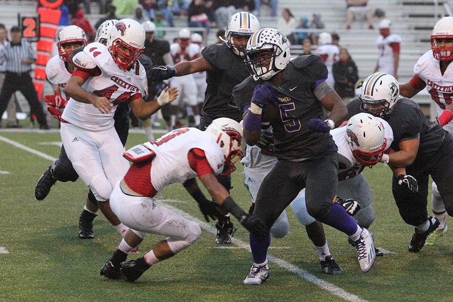 Junior running back Xavier Scott evades a Creekview defender. Scot ran for 218 yards and two touchdowns in the 42-23 win Friday.