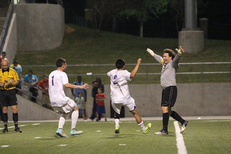 Senior Christian Rodriguez is greeted by seniors Israel Galvan and Feliciano Amaya after the conclusion of the penalty shootout.
